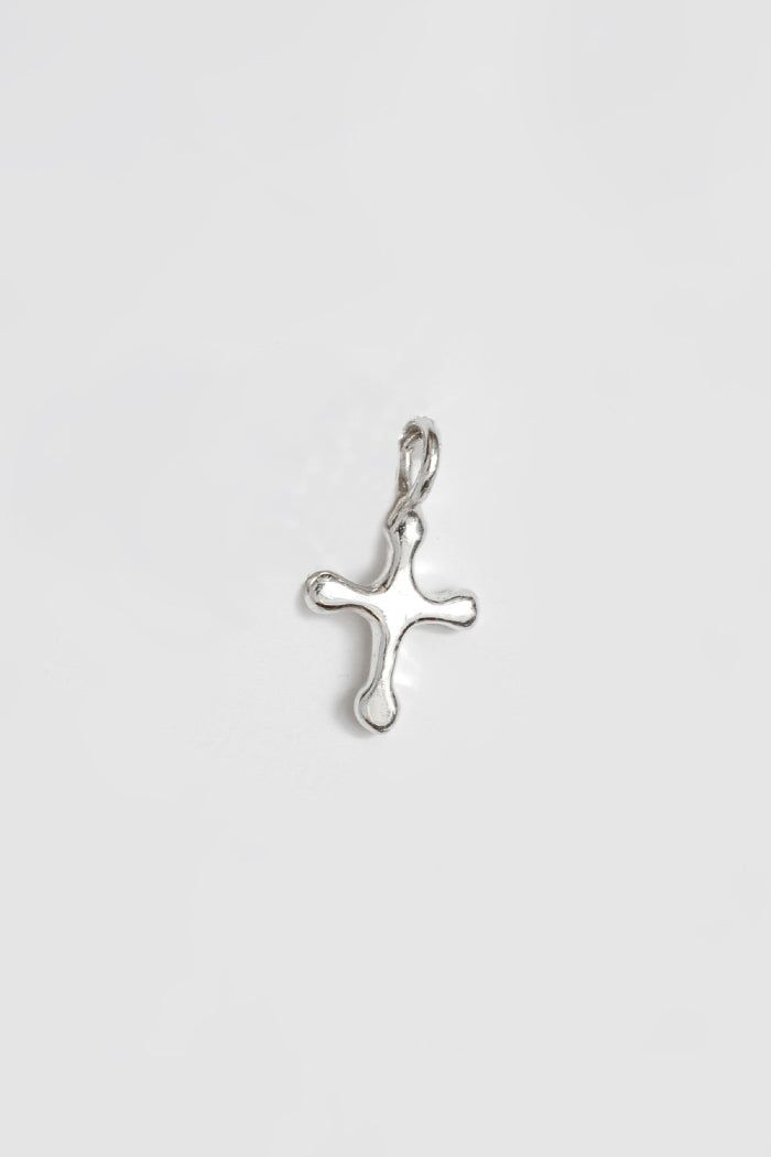 Wolf Circus Cross Charm in sterling silver. This is a single charm and does not include a chain. Layer with a simple chain like THESE. Measures 13mm x 10mm. Sterling silver. Each piece of jewelry is designed and handcrafted by a talented team in Vancouver, Canada. PIPE AND ROW Sterling Silver Charm Necklace With Cross Pendant, Handmade Sterling Silver Charms In Silver, Handmade Sterling Silver Symbolic Charms, Handmade Symbolic Sterling Silver Charms, Small Sterling Silver Jewelry With Charms, Sterling Silver Jewelry With Charms, Nickel Free Symbolic Sterling Silver Charm Necklace, Silver Sterling Charm Necklaces With Cross Pendant, Small Sterling Silver Charm Necklace