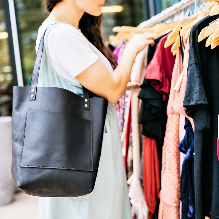 The Abbie pocketed tote is handcrafted from premium full-grain leather. This premium leather is water-resistant and is made to withstand daily use to last you a lifetime and more! The Abbie features a large pocket on the front and inside to hold all your essentials. And don't you hate losing your keys at the bottom of your purse? Well we thought of that, and the Abbie tote comes with a key hook so that doesn't happen. Also available in black. We promise you'll love it or your money back! Handmad Modern Everyday Bags With Side Pockets, Modern Bags With Side Pockets For Daily Use, Modern Bags With Side Pockets For Everyday, Black Bags With Side Pockets For Everyday Use, Leather Bag With Silt Pocket For Everyday Use, Black Everyday Bag With Side Pockets, Modern Bags With Side Pockets, Leather Bags With Pockets For Everyday Use, Everyday Black Bags With Side Pockets