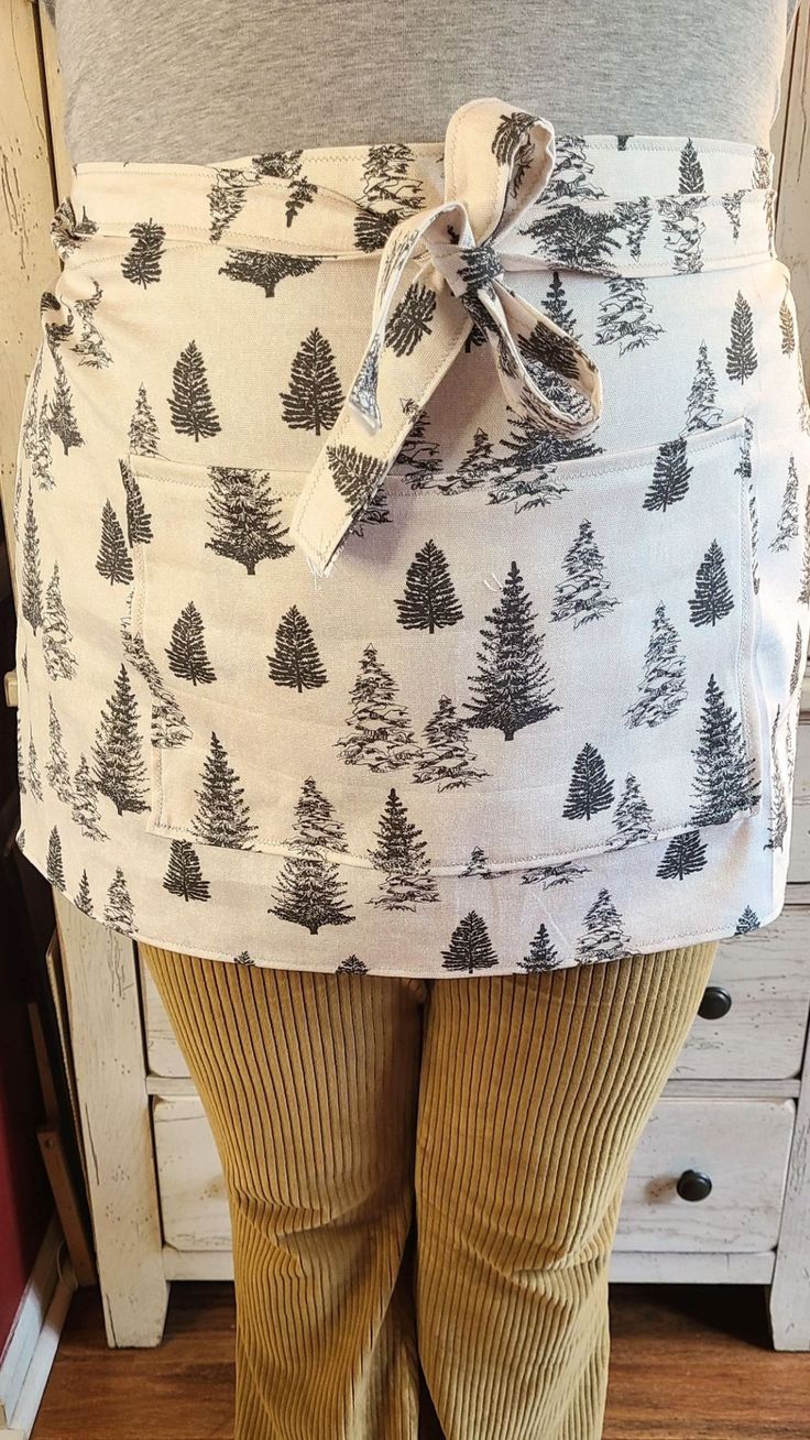 a woman wearing tights with trees on them