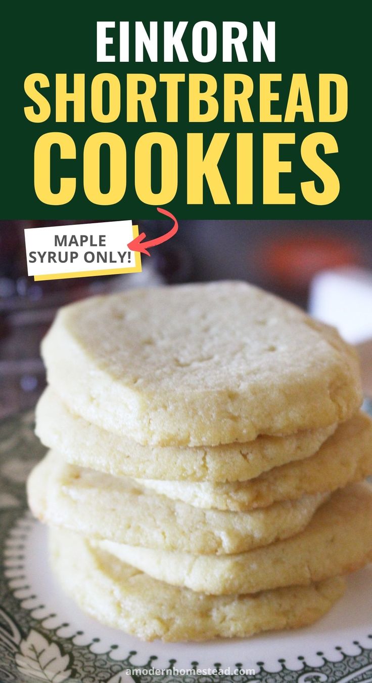 a stack of shortbread cookies sitting on top of a white plate with green lettering