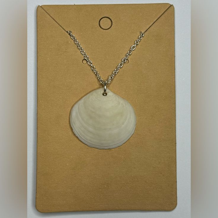 Elegant Sea Shell Hand Picked From Anna Maria Island, Fl. Silver Plated 18” Chain. Unique Design. Perfect For Any Occasion. White Chain Necklace With Round Pendant And Adjustable Chain, Adjustable White Chain Necklace Gift, Handmade White Pendant Chain Necklace, White Delicate Chain Necklace, White Chain Necklace With Round Pendant For Gift, White Handmade Adjustable Chain Necklace, White Shell Necklace With Lobster Clasp As Gift, White Necklace With Silver Chain As Gift, White Necklaces With Silver Chain