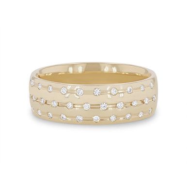 a yellow gold wedding band with diamonds