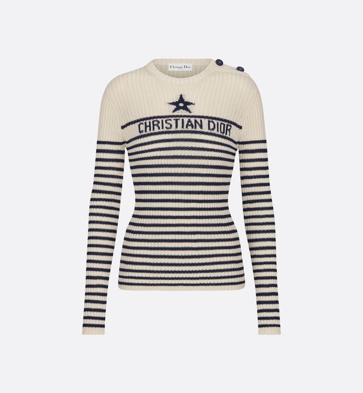 Part of the Dioriviera capsule collection, the cotton ribbed knit sweater is adorned with the timeless ecru and navy blue Dior Marinière motif. It showcases the House star symbol, as well as a jacquard Christian Dior signature. The style is distinguished by a round neck and button placket on the shoulder with anchor-engraved buttons. The sweater can complete other Dioriviera creations to complete the look.. 34 Blue Dior, Denim Swimsuit, Star Symbol, House Star, Dior Star, Christian Dior Couture, Short Denim, Dior Couture, Tuxedo Jacket