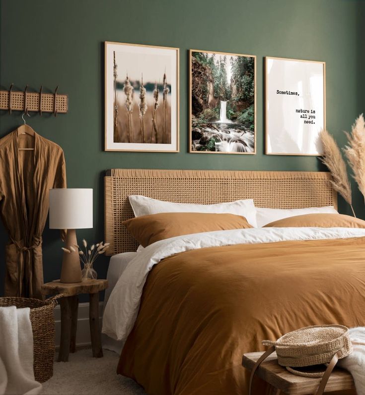 a bedroom with green walls and pictures on the wall