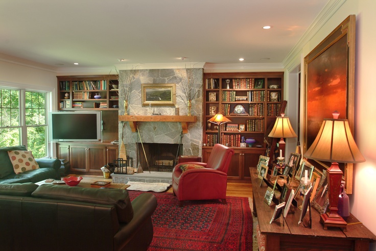 a living room filled with furniture and a fire place