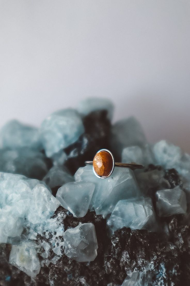 Sunstone Oval Ring Material: Stainless Steel Color: Silver Gemstone: Natural Sunstone (6x8mm, oval shape, polished) Ring Size: Adjustable Stainless Steel: Durability: Highly resistant to scratches, tarnishing, and corrosion, ensuring a long-lasting piece of jewelry. Hypoallergenic: Safe for sensitive skin, minimizing the risk of allergic reactions. Waterproof: Perfect for everyday wear, as it withstands exposure to water without damage. Sunstone: Joy and Positivity: Known for its ability to inst Minimalist Oval Opal Ring For Gift, Minimalist Oval Opal Ring Gift, Oval Amber Birthstone Jewelry, Brown Oval Gemstone Jewelry, Nature-inspired Opal Ring As Gift, Brown Oval Gemstone Rings, Oval Brown Jewelry For Anniversary, Brown Oval Jewelry For Anniversary, Amber Rings With Natural Stones For Gift