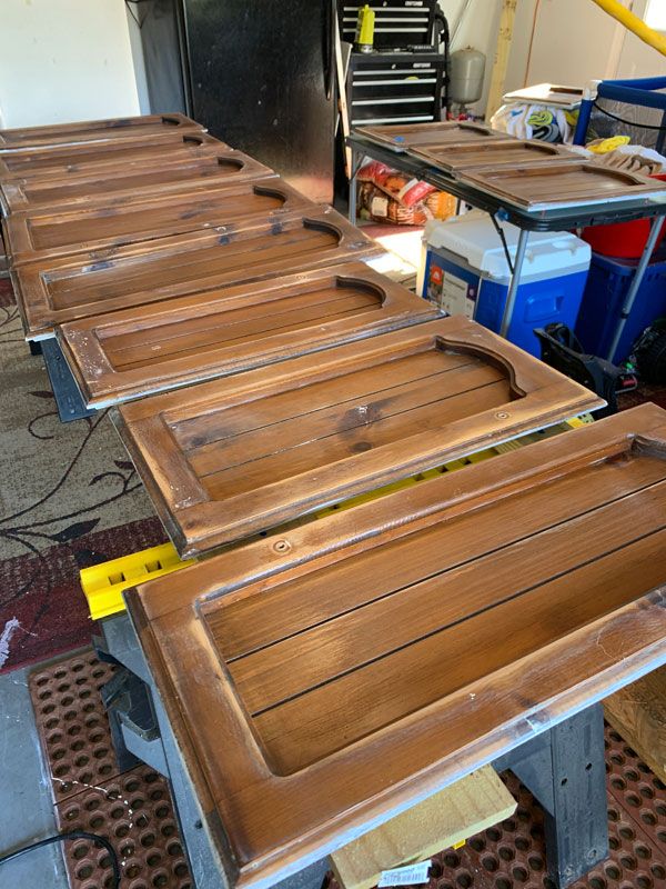 several pieces of wood sitting on top of a metal table in a room filled with tools