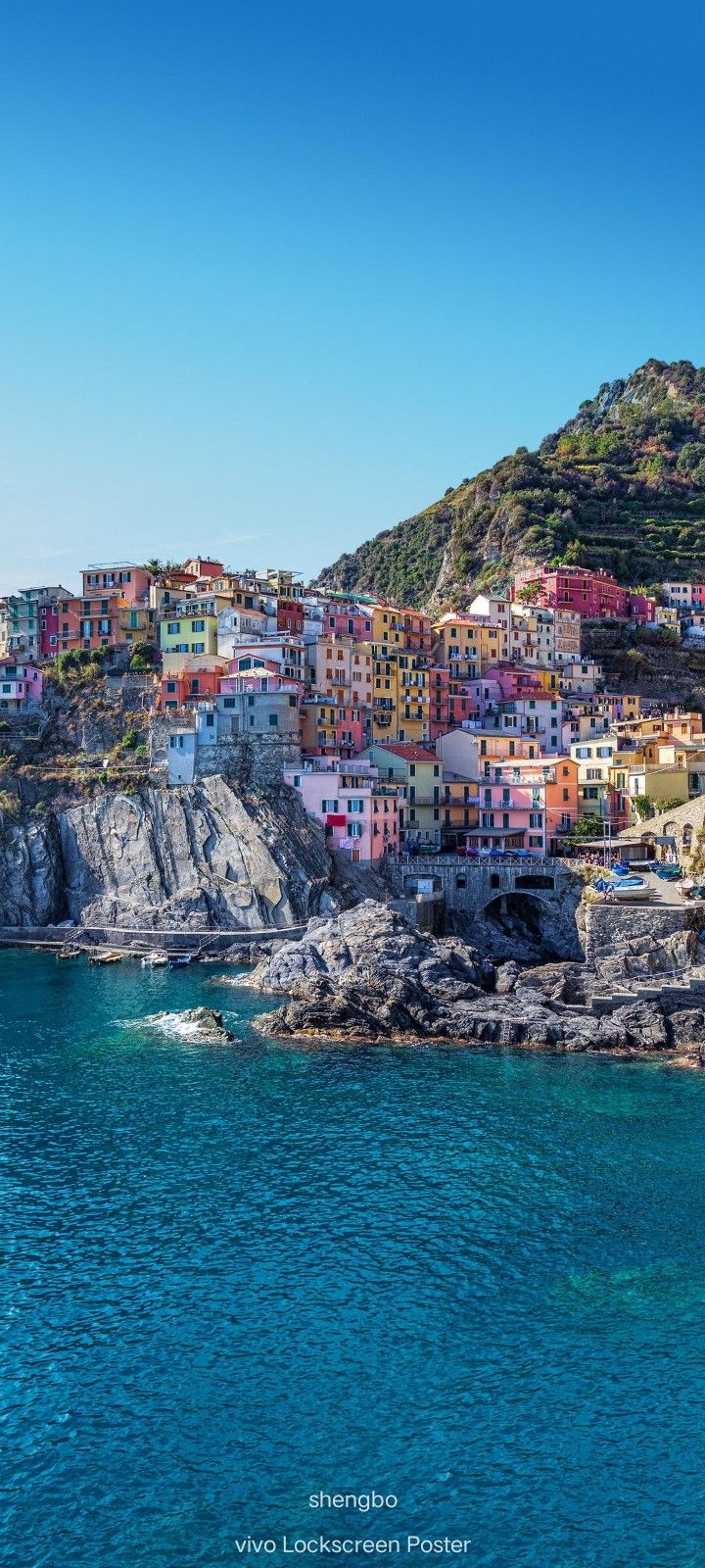 the colorful buildings are on top of the cliff