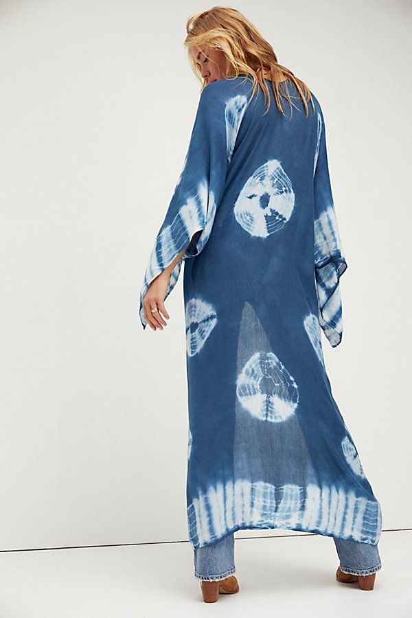 In a super soft fabric and tie dye pattern this oversized maxi kimono features statement cutout detailing under the arms. Blue Breezy Flowy Cover-up, Blue Flowy Breezy Cover-up, Flowy Long Cover-up For Vacation, Long Flowy Cover-up For Vacation, Bohemian Rayon Cover-up For Vacation, Bohemian Lightweight Cover-up For Beach Party, Beachy Cover-up With Kimono Sleeves For Festivals, Blue Flowy Cover-up For Beach Season, Flowy Unlined Cover-up For Vacation