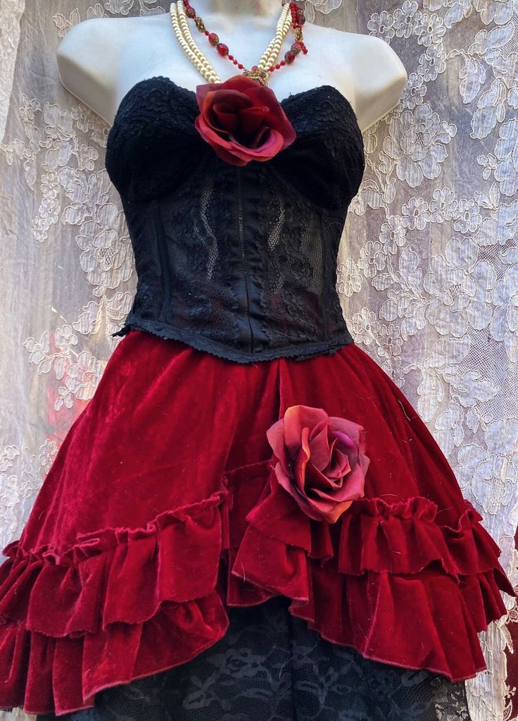 A gorgeous red velvet and black lace ruffle skirt  hand made by vintage opulence on Etsy A deep red crushed velvet skirt with ruffled red velvet, with a black lace underskirt The skirt is finished with a burgundy fabric rose Comes with black lace bustier with rose Bustier will fit 34 A/B busts Skirt waistband fits  26-30 inch waists Red Ruffled Skirt For Costume Party, Fitted Velvet Corset For Costume Party, Red Ruffled Corset Dress For Costume Party, Red Fitted Skirt For Costume Party, Fitted Corset Dress With Ruffled Skirt For Costume Party, Red Ruffle Corset Dress For Costume, Gothic Velvet Corset For Costume Party, Red Ruffled Corset Dress For Costume, Fitted Red Ruffled Skirt