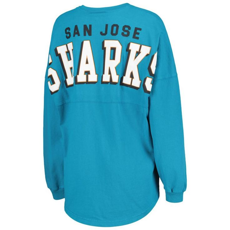 Boost your collection of official San Jose Sharks gear with this Spirit jersey T-shirt from Fanatics Branded. It features a lace-up V-neckline and dropped shoulders, ensuring that you'll be the most stylish fan on game day. The low-puff graphics on this cotton tee make it clear that your loyalty to the San Jose Sharks is second to none.Boost your collection of official San Jose Sharks gear with this Spirit jersey T-shirt from Fanatics Branded. It features a lace-up V-neckline and dropped shoulde Collegiate V-neck Top With Letter Print, Blue Crew Neck Top With Letter Print, Blue Letter Print Crew Neck Tops, Game Day Long Sleeve Tops With Team Logo, Game Day Crew Top With Team Logo, Game Day Fan Apparel Tops With Crew Neck, Cotton Crew Top With Team Name, Relaxed Fit Crew Fan Apparel Tops, Blue Casual Tops For Game Day