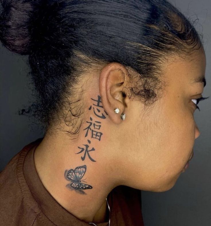 a woman with a tattoo on her neck