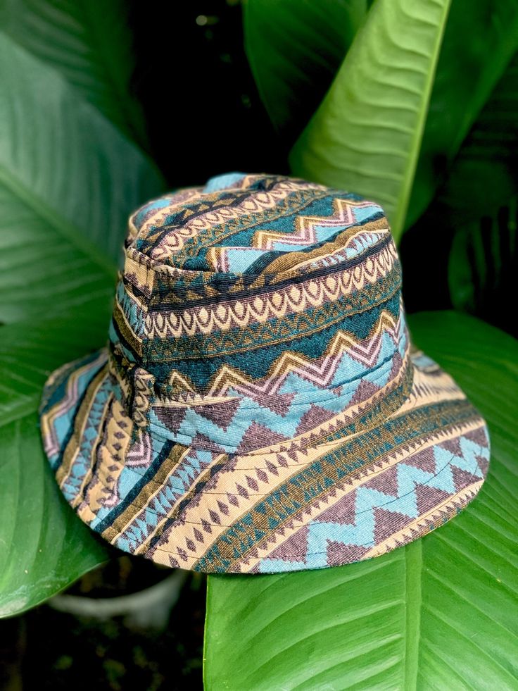 Artisan Bucket Hat | Boho-inspired bucket hat featuring a woven design with mixed patterns This Bucket Hat is made from 100% natural organic cotton ,        Hat is unisex fit great on both men and women Measurements  Large - inner circumference is 24" inches Brim 2" **These hats are handmade and so will vary slightly Blue Bucket Hat With Curved Brim For Festivals, Blue Curved Brim Bucket Hat For Festival, Blue Wide Brim Bucket Hat For Festivals, Blue Bucket Hat With Short Brim For Festivals, Traditional Adjustable Hat For Outdoor, Blue Short Brim Bucket Hat For Festivals, Blue Brimmed Bucket Hat For Festival, Bohemian Blue Bucket Hat, Blue Wide Brim Hat For Festival