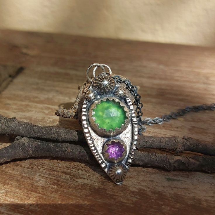 This beautiful purple and green pendant is completely handmade. It is set in lightly oxidised sterling silver and made with natural gemstones, including Amethyst and Serpentine. It is a unique, one of a kind piece. *A chain is available in a separate listing in my shop, please check the link below.  MATERIALS & SIZE: Stone: Serpentine, Amethyst Metal: Sterling Silver and Fine Silver Pendant size: 33mm by 15mm * If you would like to purchase a chain to go with the pendant, here is a link for the Amethyst Pendant Necklace, Green Pendant, Amethyst Necklace Pendant, Green Pendants, Purple And Green, Amethyst Pendant, Oxidized Sterling Silver, Simple Necklace, Handmade Jewellery