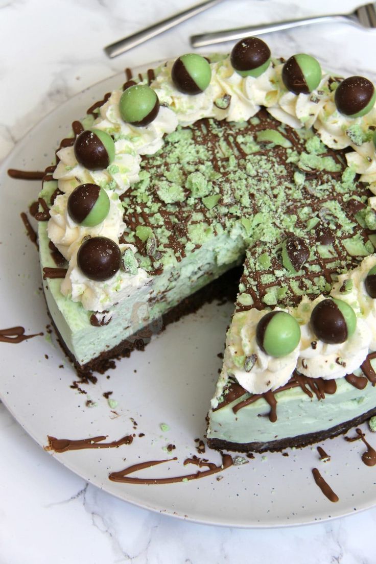 a green cake with chocolate and white frosting