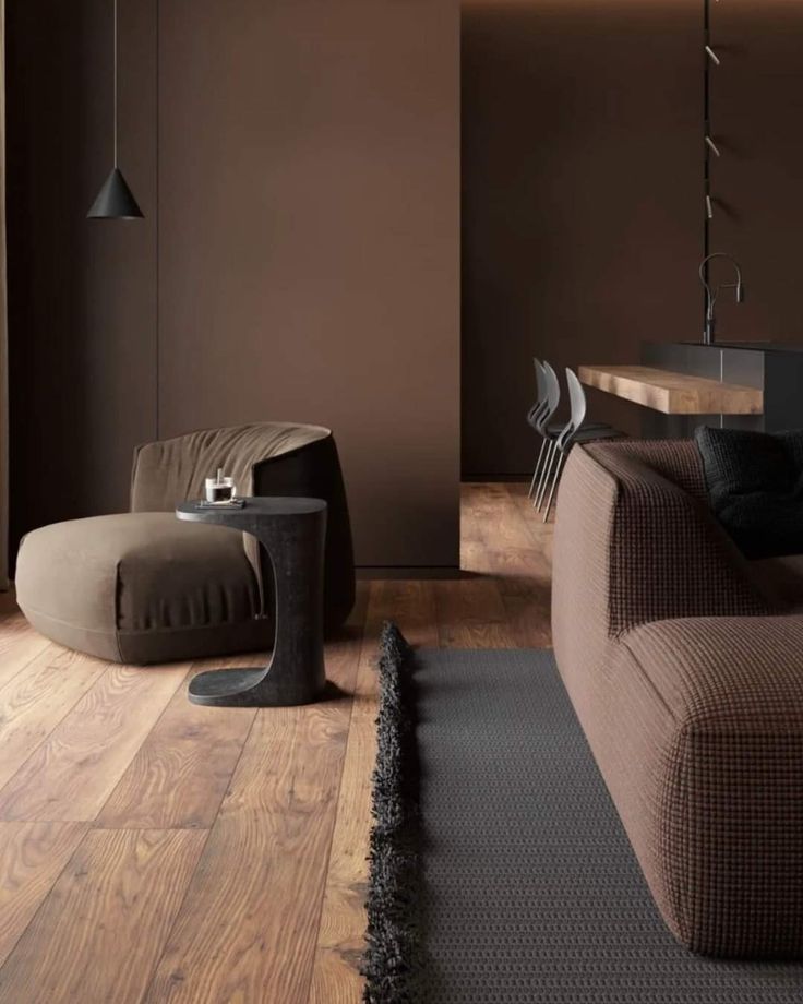 a living room filled with furniture and wooden floors