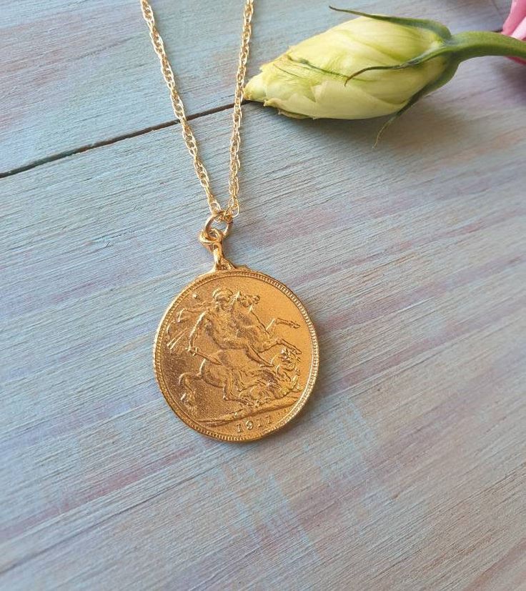 This coin pendant necklace was 100% handmade. The pendant is made of a Moroccan gold coin to which I designed with a vintage inspired fashion. The necklace is 14k gold filled chain with a 14k gold plated coin pendant. It is also available in sterling silver. Dimensions: The 14k gold necklace is available in multiple lengths. The antique coin pendent's diameter is 2.1 cm (0.8 inches) This Gold coin necklace is delicate unique and beautiful for daily wear. To see other necklaces I make: https://ww Vintage Brass Coin Necklace With Coin Pendant, Vintage Brass Coin Pendant Necklace, Classic Yellow Gold Charm Necklace With Coin Pendant, Vintage Gold Coin Brass Necklace, Brass Coin Pendant Charm Necklace, Vintage Gold Brass Coin Necklace, Vintage Brass Coin Necklace, Tarnish Resistant, Vintage Brass Coin Necklace Tarnish Resistant, Vintage Brass Medallion Necklace Tarnish Resistant