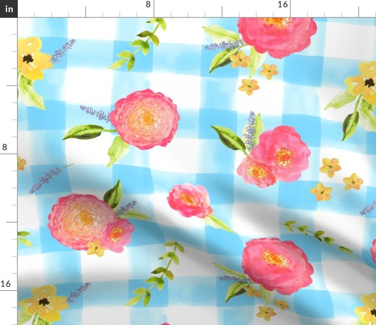 a blue and white checkerboard with pink flowers on it, next to a ruler