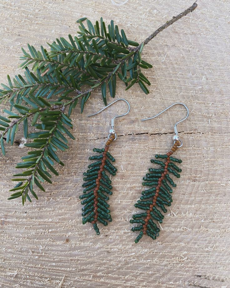 This pair of beaded earrings were inspired by the big hemlock tree growing in my front yard. Earrings are 1 and a 1/2" long and made with size 11 delicas. Made to look very realistic Beaded Fern Earrings, Beaded Tree Earrings, Christmas Tree Beaded Earrings, Nature-inspired Beaded Dangle Earrings As Gift, Nature-inspired Dangle Beaded Earrings As Gift, Nature-inspired Dangle Beaded Earrings For Gift, Beaded Leaf Pattern, Metis Beaded Earrings, Indigenous Christmas