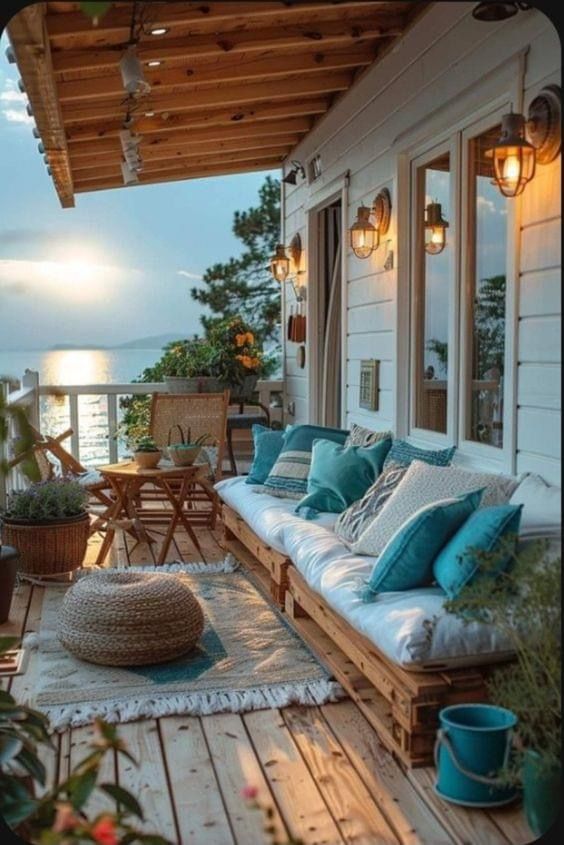 a wooden porch with lots of pillows on it