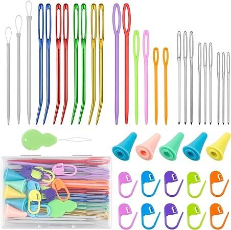 assorted colored crochet hooks and knitting needles