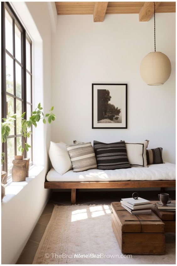 a living room filled with furniture and large windows