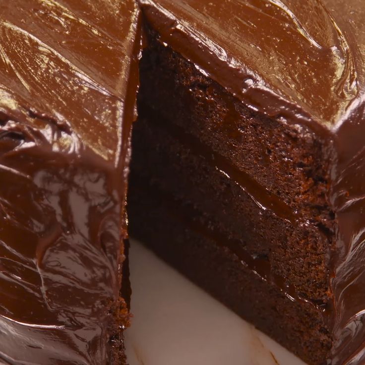 a chocolate cake with one slice missing from it