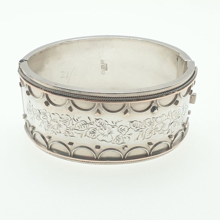 "A thick snap bangle bracelet made from sterling silver with hallmarks and date letter \"m\" for 1886. The bracelet weighs approx. 37.97 grams so is pretty heavy and chunky and the internal measurements from left to right are 6.19 cm. It is 31.93 mm wide and opens and closes as it should. PLEASE NOTE: There is a minor dent on the rear, captured best in the video. Stunning piece. Please check out the other items in my shop. Be sure to view all photos and videos for condition and read the titles a Luxury Antique Hallmarked Sterling Silver Bracelet, Luxury Traditional Antique Silver Bracelet, Hallmarked Vintage White Gold Bangle, Vintage Hallmarked White Gold Bangle, Vintage White Gold Hallmarked Bangle, Victorian Silver Engraved Bangle, Victorian Etched Cuff Bracelet, Victorian Style Silver Engraved Bangle, Victorian Style Engraved Silver Bangle