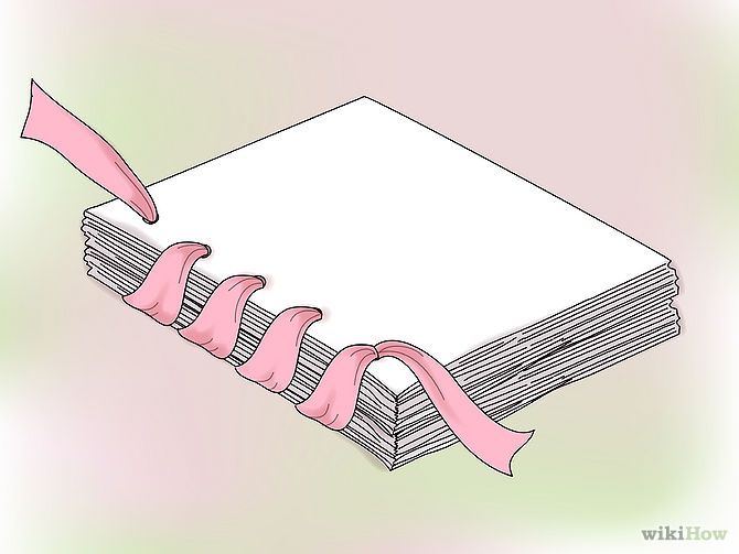 a stack of books with pink ribbon tied around them