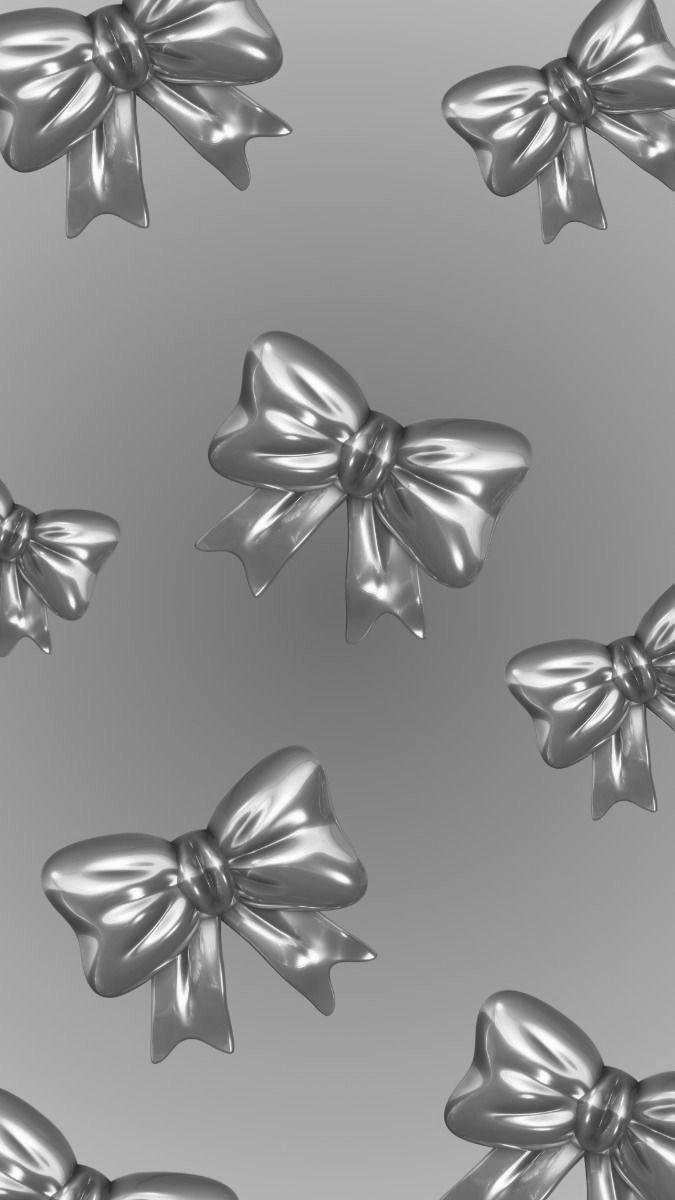 silver bows on a gray background with no one around them to see the image in full color