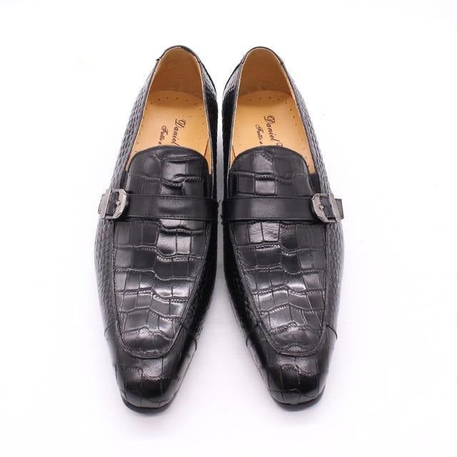 Introducing our exquisite Luxury CrocPrint Buckle Strap Slip-On Leather Loafers, crafted with the finest genuine cow leather for a touch of luxury and elegance. These loafers feature a rubber outsole for excellent traction and durability, while the slip-on closure allows for easy on and off. With their timeless charm and maximum comfort, these loafers are a must-have addition to your footwear collection. Order your pair today and experience the perfect blend of luxury, comfort, and style. Luxury Black Slip-on Oxfords, Luxury Slip-on Leather Shoes For Business, Luxury Business Slip-ons With Almond Toe, Luxury Black Slip-ons With Round Toe, Elegant Formal Slip-ons With Textured Sole, Luxury Slip-on Business Moccasins, Black Leather Tassel Loafers With Textured Sole, Formal Closed Toe Slip-ons With Leather Sole, Semi-formal Pointed Toe Moccasins With Leather Sole