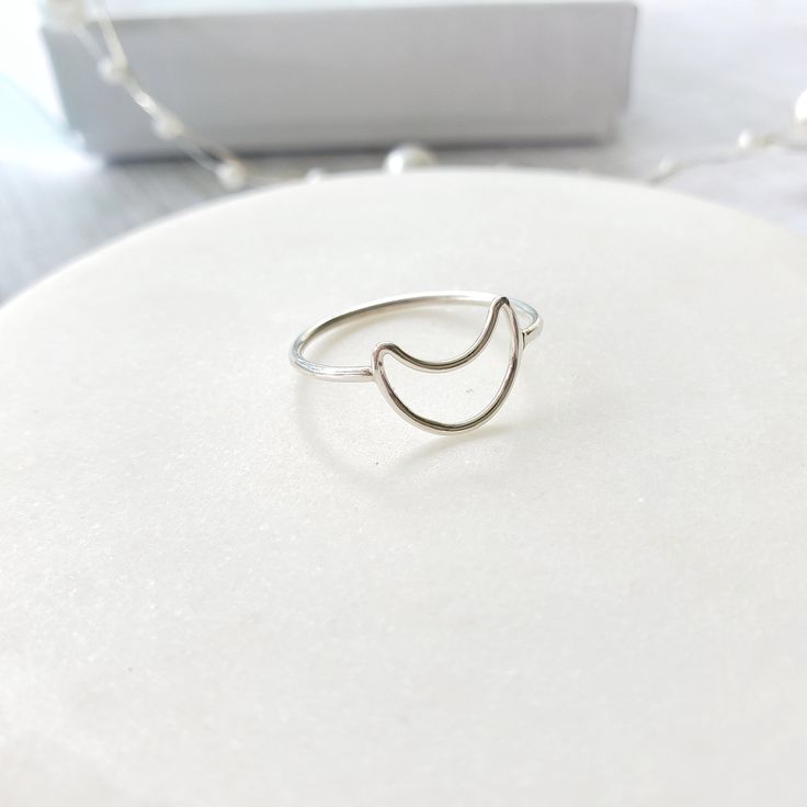 Cute crescent moon ring handmade in 925 sterling silver. This ring is perfect to wear alone or with a stackable ring. It is also beautiful as a midi ring. Beautiful gift for a special day. Gift for girls, for mom, for daughter, wife, grandmother, friend, girlfriend or an important person. It is ideal gift for birthday, anniversary, mother's day, Christmas, bridesmaid. ♥ Item Details: Metal type: Sterling silver Karat / purity: 925. Moon dimensions: 8.8 x 11.8mm The ring is 100% handmade. Each ri Minimalist Crescent Moon Charm Ring, Minimalist Adjustable Crescent Ring, Minimalist Adjustable Rings With Moon Charm, Minimalist Adjustable Ring With Moon Charm, Minimalist Rings With Moon Charm For Gifts, Minimalist Moon Charm Rings For Gifts, Minimalist Moon Charm Rings As Gift, Minimalist Sterling Silver Moon Midi Rings, Silver Crescent Midi Rings In Celestial Style