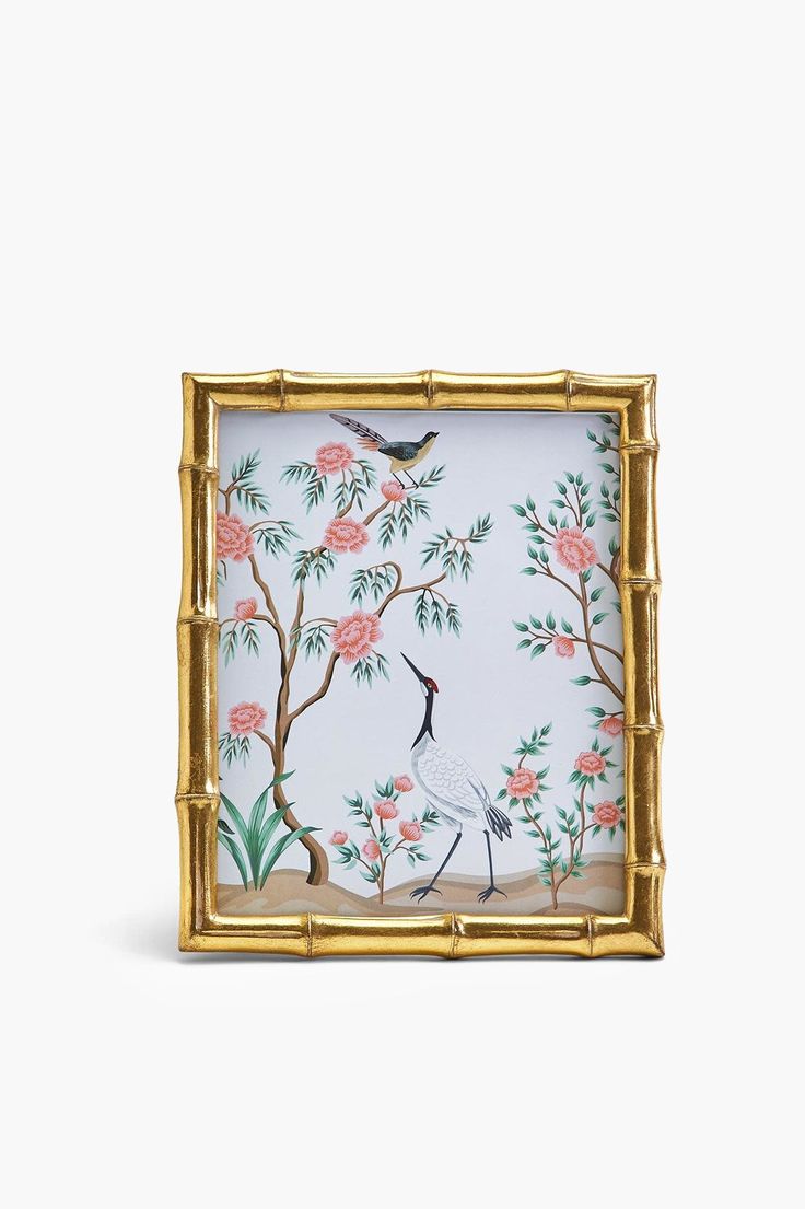 an ornately decorated frame with birds and flowers on it, against a white background