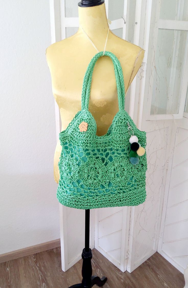 RAFFIA raffia bag, summer companion beautifully large handmade In a patchwork style in beautiful, trendy green 2 jute tassels or pompom on the key ring for easy removal The bag is lined with cotton fabric and has a small inner compartment Braided handles Long durability of the bag 100% raffia, palm fiber, robust material, very durable, just wipe clean Natural colours in dimensions: width approx. 37 cm Height approx. 38 cm Handle length to the middle of the bag measured approx. 24 cm Can be worn Green Jute Bags With Braided Handles, Handwoven Green Crochet Beach Bag, Green Woven Jute Bag, Green Jute Bag For Vacation, Green Woven Shoulder Bag For Vacation, Green Crochet Straw Tote Bag, Green Woven Crochet Bag For Beach Season, Green Crochet Tote Straw Bag, Beach Handwoven Green Bag