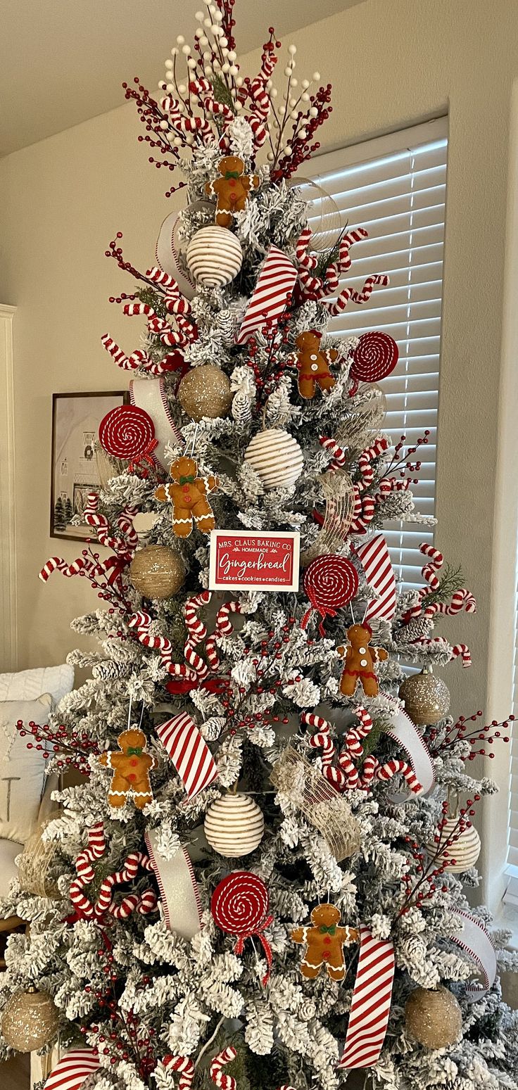 a christmas tree decorated with candy canes and candies