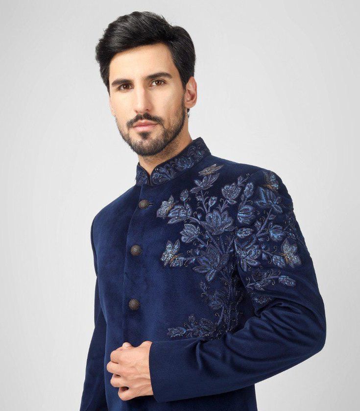 Blue Indo Western Sherwani With Floral Hand Embroidery  *Premium Quality Velvet  Fabric *Colour Blue ( Can be done in any color) * Work - Embroidery, Thread Work, Dubka Work in Antique Gold, Sequin And Beads  *Buttons - Metal Buttons In Dark Gold Note For Perfect Fitting * Pls Check Your Body Chest Exact Measurement With Out Adding Any Space or Gap From Your Side * Kindly Mention Your Height While Placing The Order 🔺Disclaimer: Product Colour May Slightly Vary Due to Photographic Lighting Sources or Your Monitor Settings Thank You for Visiting Traditional Blue Nehru Jacket With Intricate Embroidery, Blue Nehru Jacket With Intricate Embroidery For Diwali, Indigo Embroidered Traditional Wear For Designer Occasions, Designer Embroidered Indigo Traditional Wear, Blue Chikankari Embroidered Nehru Jacket For Reception, Semi-stitched Indigo Wedding Sets, Diwali Blue Nehru Jacket With Intricate Embroidery, Bollywood Style Indigo Sets For Wedding, Semi-stitched Long Sleeve Bandhgala For Reception