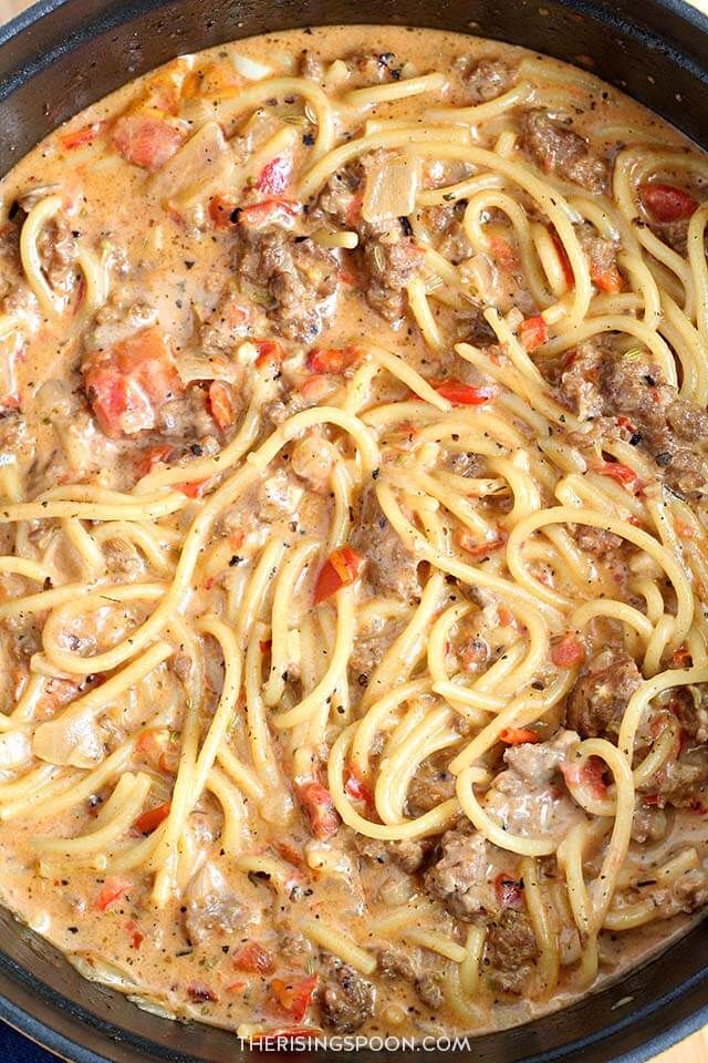 pasta with meat and tomato sauce in a skillet