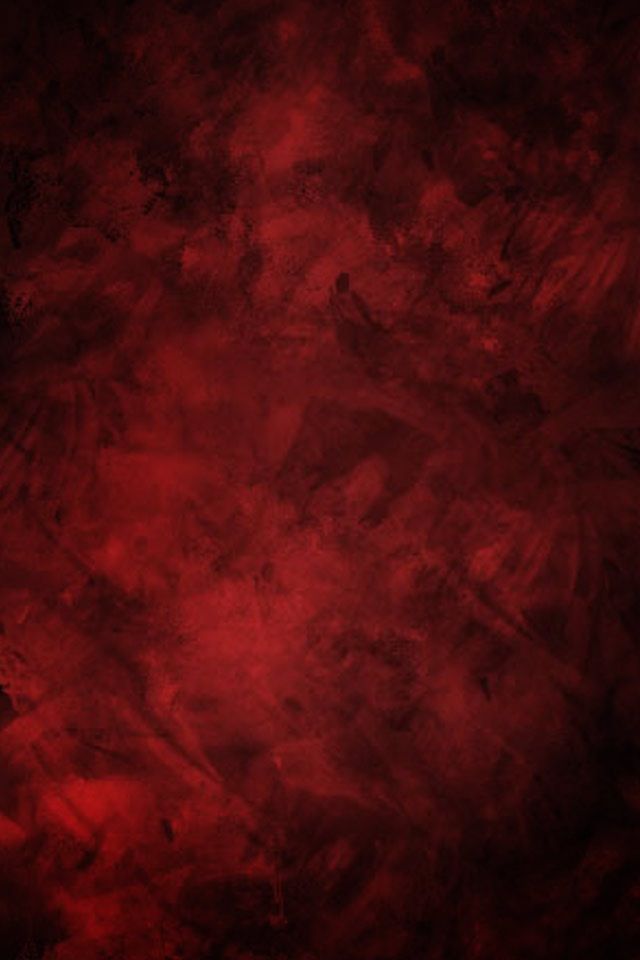 an abstract red background with black spots