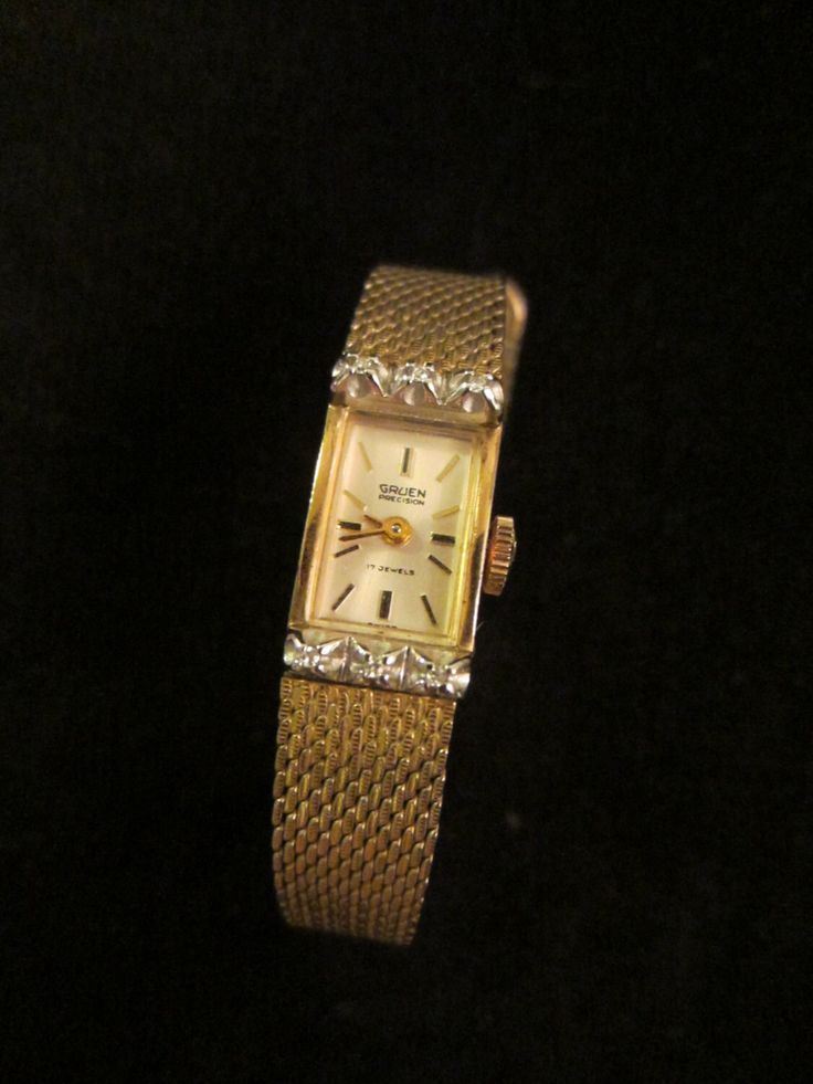 Art deco charming, Gruen Percision 17 Jewels, 10 K RGR Bezel Stainless Back, golden wrist watch,  Pat. Pen. 1/20 10 KT GF Kreisler U.S.A. noted on band, watch, in etching & engraving. Hand winding, and is working, Excellent presentation. A 6.5" around the wrist, 1" x half inch, with six small symmetric diamonds or white stones. Golden Wrist Watch, Modern Clock, Square Watch, White Stone, Wrist Watches, Jewellery And Watches, Halloween Shopping, Wrist Watch, Jewelry Watches