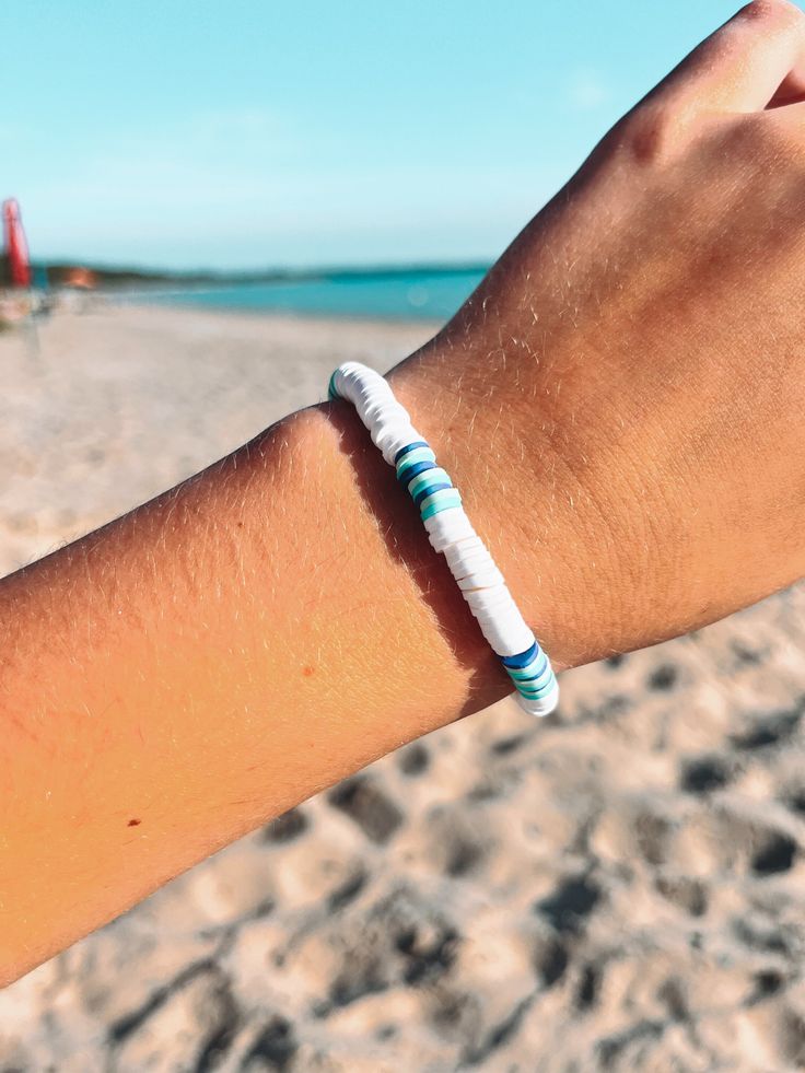 Sunkissed Sandbanks  ✨ This Beach Surfer Style bracelet is perfect for all your summer endeavours. It is handmade of polymer clays beads which are known to be quite durable. ✨ SIZING: Each bracelet measures around 6.5 inches which fits great for most teens and adults. However please contact me if you would like a custom length!  💌 FREE SHIPPING! - Through Canada Post Oversized Lettermail Feel free to message me with any questions, I will typically respond within 24 hours. I'm a teen who makes a White Adjustable Stretch Bracelet With Beachy Style, Adjustable White Stretch Bracelet With Beachy Style, White Hand-strung Bracelets For Beach, White Strand Bracelets For Vacation, White Strand Bracelet For Vacation, White Adjustable Beachy Stretch Bracelet, White Hand-strung Beaded Bracelets For Beach, White Hand-strung Beaded Bracelet For Beach, White Beaded Beachy Bracelet