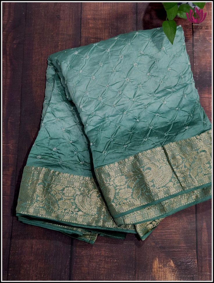 A Beautiful Fusion saree! Tie dyed Bandhani work on Very soft Bhagalpuri silk with kanchi style zari border, a wonderful amalgamation of art on fabric! This pale Green saree is very soft and easy to drape. The unstitched blouse piece comes in brown brocade material. Fall and Pico - Done. Blouse - Unstitched. Please note: Color may vary slightly from the picture. Green Tussar Silk Pre-draped Saree With Dupatta, Pista Green Raw Silk Churidar With Traditional Drape, Navratri Raw Silk Churidar With Cutdana, Navratri Tussar Silk Churidar With Resham Embroidery, Tussar Silk Churidar With Resham Embroidery, Chanderi Cutdana Pre-draped Saree, Festive Banarasi Silk Pre-draped Saree With Zari Work, Festive Pista Green Banarasi Silk Pre-draped Saree, Pre-draped Art Silk Saree With Resham Embroidery For Puja