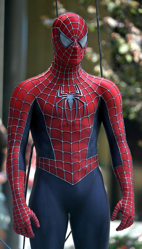 a man in a spider - man suit on the set of the amazing spiderman