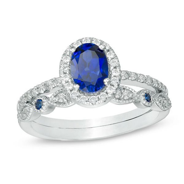 Start your endless love story with this vintage-inspired bridal set. Created in cool 10K white gold, the classic engagement ring showcases a 7.0 x 5.0mm oval-shaped lab-created bright blue sapphire wrapped in a frame of and atop a slender shank lined with glimmering petite lab-created white sapphires. On your wedding day, complete her look with coordinating band decorated with alternating created white sapphire-adorned marquise shapes and bezel-set created blue sapphires - all wrapped in milgrai Quinceanera Outfit, Oval Morganite Ring, Blue Diamond Engagement Ring, Band Ideas, Classic Engagement Ring, Leaf Engagement Ring, Elegant Engagement Rings, Sapphire Rings, Classic Engagement