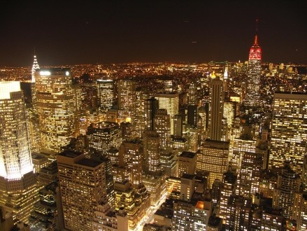 an aerial view of new york city at night from the top of the empire building