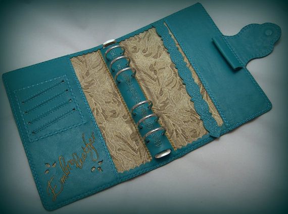 a blue leather book with writing on it