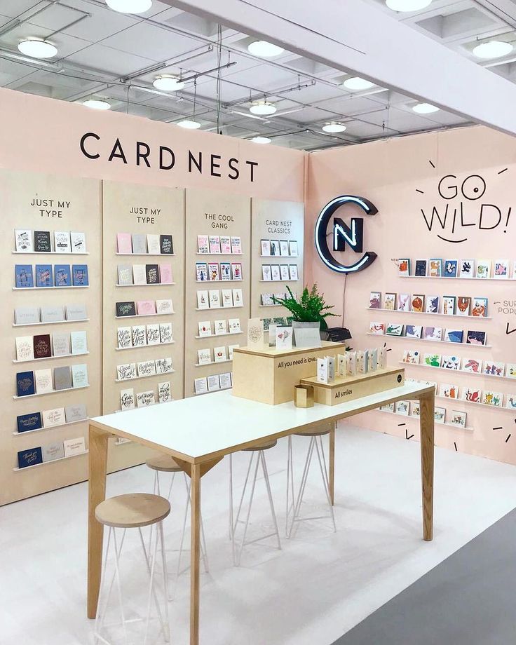 a room filled with lots of cards on display in front of a sign that says cardnest go wild