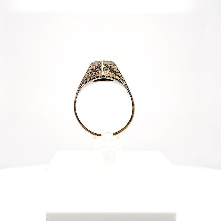 This is part of Chairish’s Fine Jewelry assortment.  A very fine antique engraved 14k gold and diamond ring.  With a lovely ca. 0.24 ct. Old European cut diamond (Color: G /Clarity: I1) set at the center of a hexagonal setting that is engraved with a feathered design to the band and shoulders.  Accompanied by a GEMLAB (Gemological Appraisal Laboratory) report.   Simply a wonderful ring!  Date: 20th Century  Overall Condition: It is in overall good, as-pictured, used estate condition with some ve Antique Dome Ring Stamped 14k As Gift, Victorian 14k Gold Diamond Cut Rings, Antique Signet Ring With Polished Finish For Formal Occasions, Engraved White Gold Diamond Ring Stamped 14k, Classic White Gold Initial Ring With Diamond Cut, Classic Engraved Dome Ring For Formal Occasions, Luxury Engraved Ring With Diamond Cut For Formal Occasions, Luxury Formal Signet Ring With Intaglio, Formal Engraved Yellow Gold Signet Ring