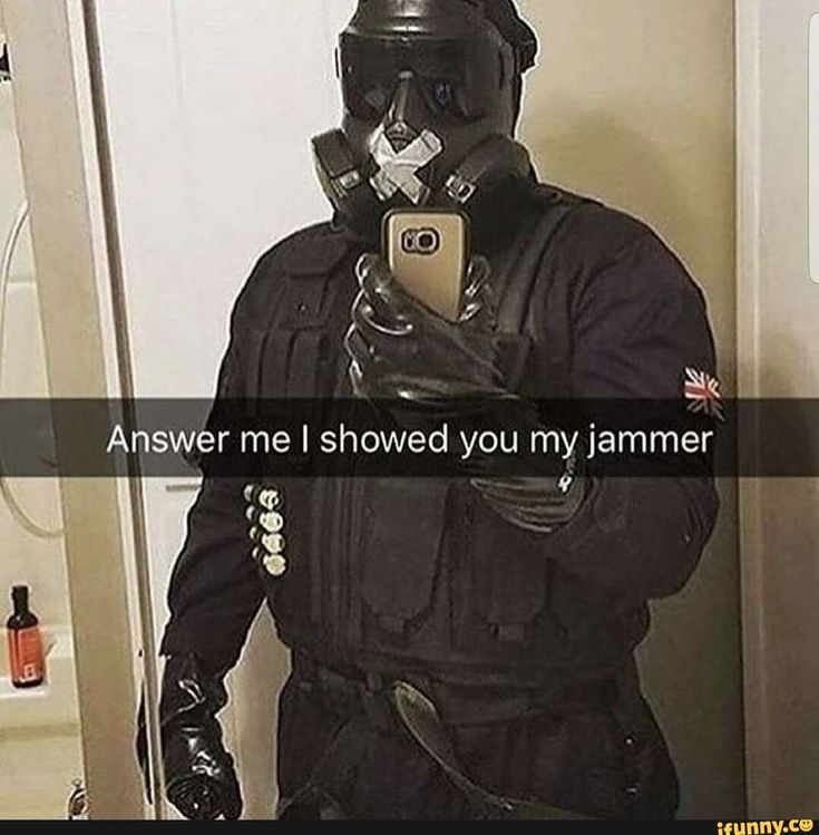 a man wearing a gas mask and holding a cell phone in his hand with the caption, answer me i showed you my jammer