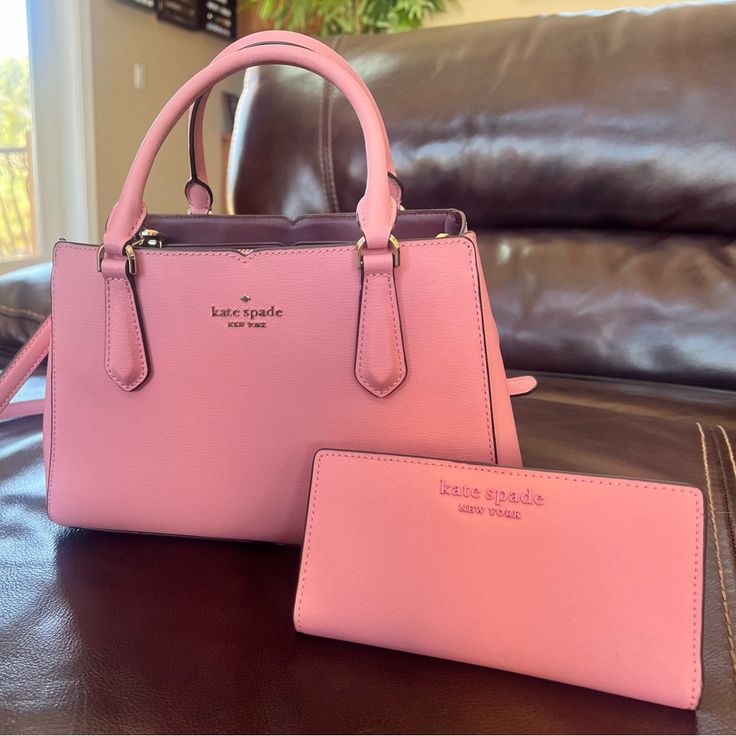 Beautiful Gently Used Kate Spade Purse And Wallet. The Purse Can Be Used As An Either Crossbody Or A Tote. Both Pieces Are In Very Good Condition. Really Nice Pink Color For Spring Or Summer! Purse Is Roomy Without Being Bulky - The Compartments Make For Easy Organization. Wallet Is Slimline And Fits In Purse Nicely. Evening Pink Bags With Card Slots, Pink Evening Bags With Card Slots, Kate Spade Formal Bags With Card Slots, Elegant Blush Wallet For Everyday Use, Pink Leather Bifold Bags, Classic Pink Bag With Interior Card Slots, Elegant Blush Wallet, Formal Pink Kate Spade Wallets, Kate Spade Pink Wallet For Everyday Use