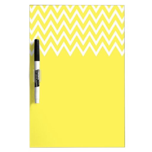 a yellow and white chevroned pattern dry eraser with black marker on it